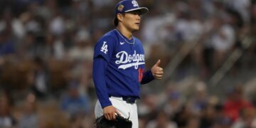 Yoshinobu Yamamoto, a pitcher for the Los Angeles Dodgers, gives a thumbs up.