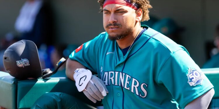 Seattle Mariners infielder Josh Naylor in the dugout during a spring training game.