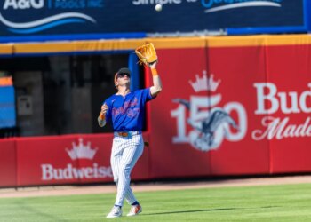 A.J. Ewing catches a fly ball from St. Louis Cardinals Chase Davis in the fifth inning during Spring Training at Clover Field, Wednesday, Feb. 25, 2026.