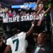 Seattle Seahawks quarterback Geno Smith (7) high-fives fans after the game at MetLife Stadium.