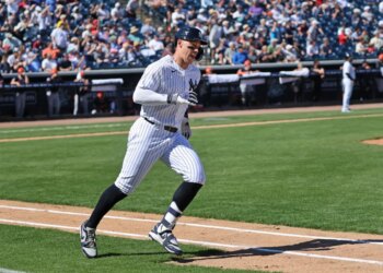 New York Yankees right fielder Aaron Judge #99 running around the bases after hitting a 2-run homer.
