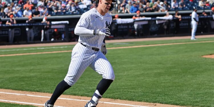 New York Yankees right fielder Aaron Judge #99 running around the bases after hitting a 2-run homer.