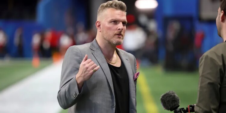 Pat McAfee speaking into a microphone during the Chick-fil-A Peach Bowl.
