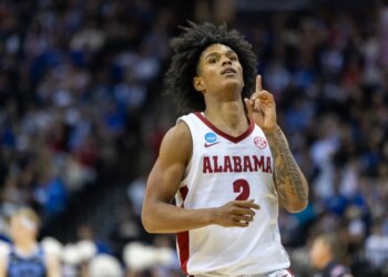 Alabama Crimson Tide guard Aden Holloway celebrates a 3-point basket.
