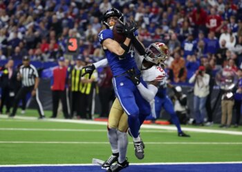 Indianapolis Colts wide receiver Alec Pierce (14) makes a catch for a touchdown defended by San Francisco 49ers cornerback Darrell Luter Jr. (28) in the second quarter of the game at Lucas Oil Stadium.