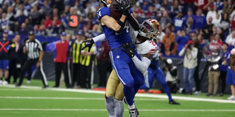 Indianapolis Colts wide receiver Alec Pierce (14) makes a catch for a touchdown defended by San Francisco 49ers cornerback Darrell Luter Jr. (28) in the second quarter of the game at Lucas Oil Stadium.