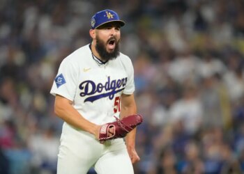 Los Angeles Dodgers relief pitcher Alex Vesia celebrates after the seventh inning.