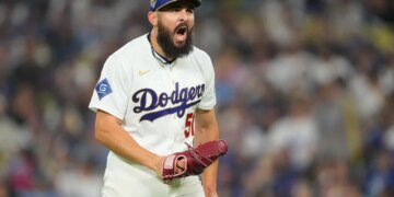 Los Angeles Dodgers relief pitcher Alex Vesia celebrates after the seventh inning.