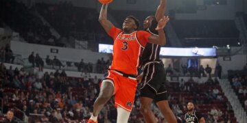 Auburn Tigers forward KeShawn Murphy (3) drives to the basket as Mississippi State Bulldogs guard Shawn Jones Jr. (5) defends during the first half.