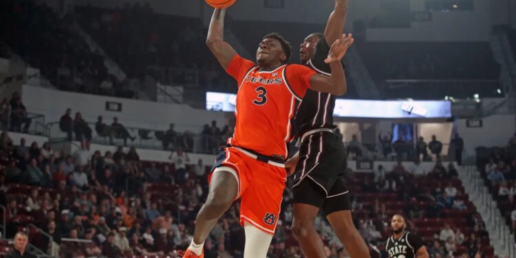 Auburn Tigers forward KeShawn Murphy (3) drives to the basket as Mississippi State Bulldogs guard Shawn Jones Jr. (5) defends during the first half.