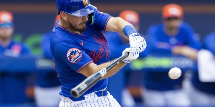 Veteran catcher Austin Barnes, hitting a single earlier in spring training, is hoping to land a spot with the Mets.