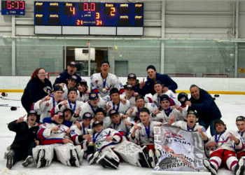Bellmore-Merrick celebrates after winning the state championship in high school boys hockey.