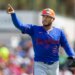 New York Mets pitcher Freddy Peralta points during a Spring Training game.
