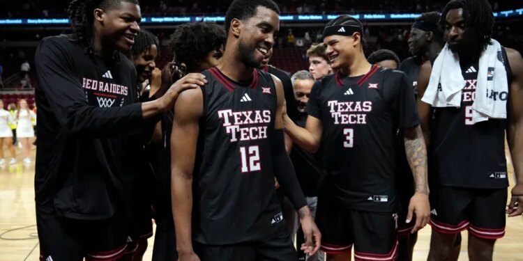 Texas Tech forward Donovan Atwell (12) celebrates with teammates after an NCAA college basketball game against Iowa State, Saturday, Feb. 28, 2026, in Ames, Iowa.