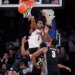 UConn forward Tarris Reed Jr. (5) blocks Georgetown guard Jeremiah Williams (25) during an NCAA college basketball game.