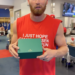 Texas Rangers star Brandon Nimmo holding a Rolex gift box.