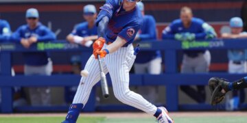 New York Mets third baseman Brett Baty bats during spring training.