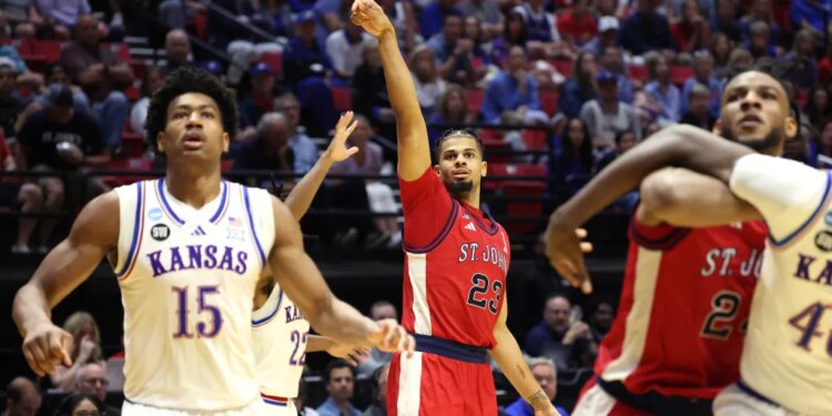 St. John's Red Storm forward Bryce Hopkins #23 shooting a jump shot during an NCAA Tournament game against the Kansas Jayhawks.