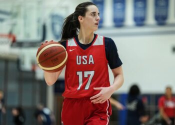 Caitlin Clark dribbling a basketball at a training camp for the U.S. women's national basketball team.