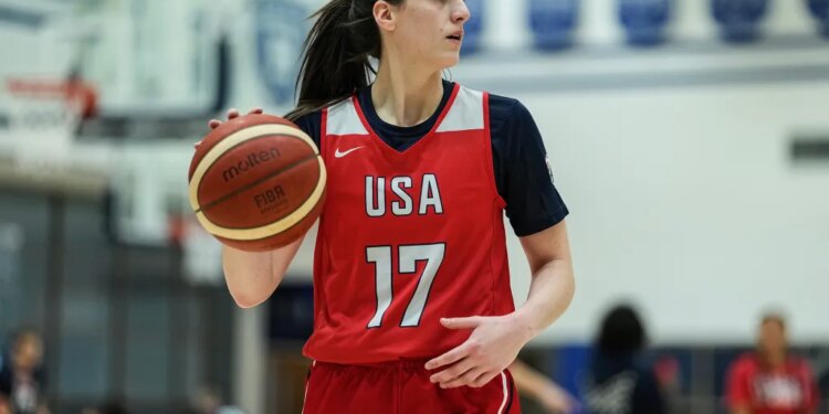 Caitlin Clark dribbling a basketball at a training camp for the U.S. women's national basketball team.