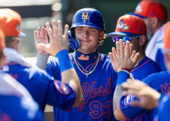 New York Mets’ Carson Benge (93) celebrates in the dugout after scoring on a wild pitch against the St. Louis Cardinals.
