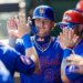 New York Mets’ Carson Benge (93) celebrates in the dugout after scoring on a wild pitch against the St. Louis Cardinals.