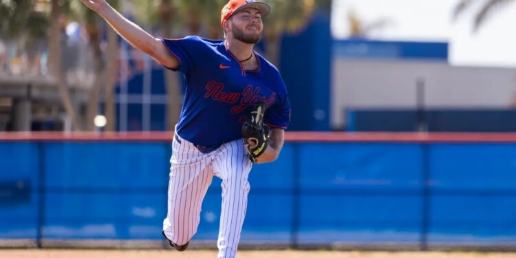 New York Mets pitcher Christian Scott throwing a baseball during spring training.