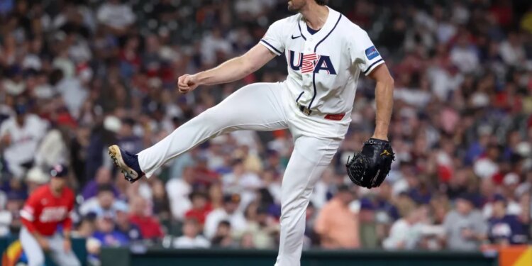 United States pitcher Clay Holmes (35) throws a pitch against Great Britain.