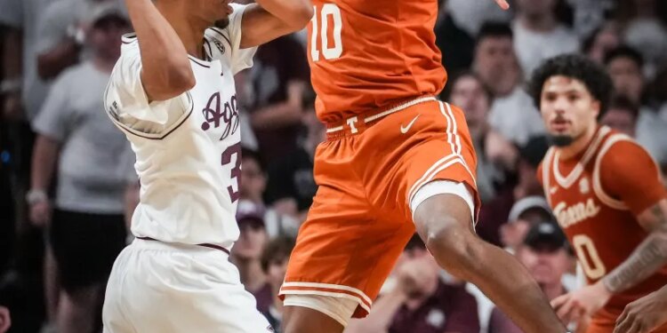 Texas forward Nic Codie (10) leaps to block a pass from Texas A&M Aggies guard Rylan Griffen (3) during a basketball game.