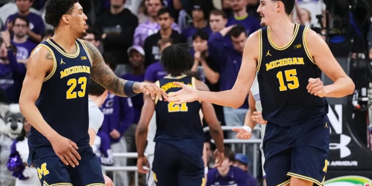Michigan basketball players Aday Mara and Yaxel Lendeborg celebrate during a game against Northwestern.