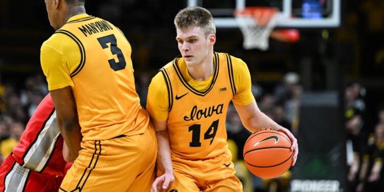Iowa basketball players #14 and #3 on the court.