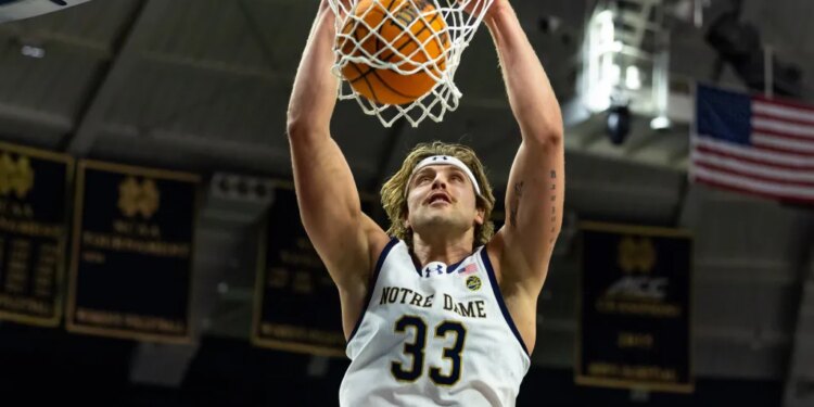 Notre Dame Fighting Irish forward Carson Towt (33) dunks against the NC State Wolfpack during the first half at Purcell Pavilion at the Joyce Center.