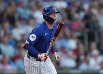 Chicago Cubs center fielder Pete Crow-Armstrong (4) hits against the Cincinnati Reds in the first inning at Sloan Park.
