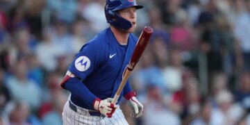 Chicago Cubs center fielder Pete Crow-Armstrong (4) hits against the Cincinnati Reds in the first inning at Sloan Park.