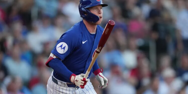 Chicago Cubs center fielder Pete Crow-Armstrong (4) hits against the Cincinnati Reds in the first inning at Sloan Park.
