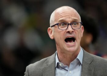 UConn head coach Dan Hurley reacting during an NCAA college basketball game.