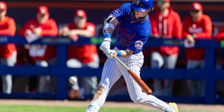 New York Mets outfielder Carson Benge hits a single in the fifth inning against the St. Louis Cardinals during Spring Training.