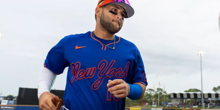 Bo Bichette (19) jogs to the dugout during Spring Training.