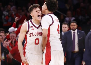 Dylan Darling (left) celebrates with Oziyah Sellers during the second half of St. John's 72-52 Big East title-clinching win over  UConn on March 14, 2026 at the Garden.