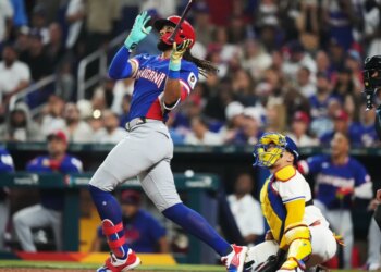 Dominican Republic's Fernando Tatis Jr. hits a three-run home run during the fourth inning of a World Baseball Classic game against Venezuela on March 11, 2026.