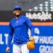 New York Mets Pitcher Freddy Peralta smiles during a workout.