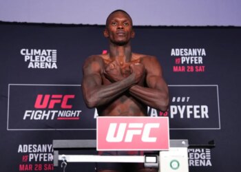 Israel Adesanya on the scale during the UFC Fight Night official weigh-ins for Adesanya vs Pyfer.