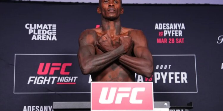 Israel Adesanya on the scale during the UFC Fight Night official weigh-ins for Adesanya vs Pyfer.