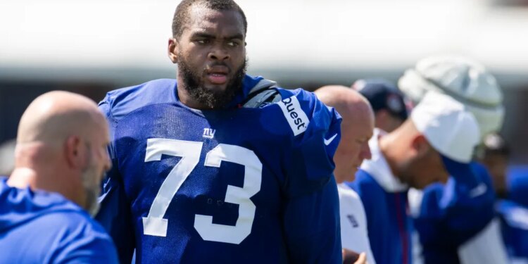 New York Giants offensive tackle Evan Neal (73) looks on during training camp at the Quest Diagnostics center, Tuesday, July 29, 2025, in East Rutherford, New Jersey.