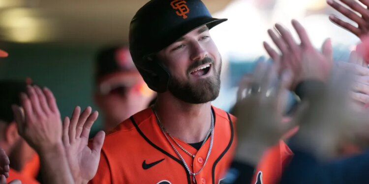 Bryce Eldridge of the San Francisco Giants smiles and celebrates with teammates.