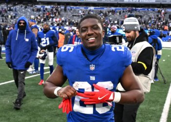 New York Giants running back Devin Singletary (26) smiles after a game.