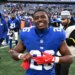 New York Giants running back Devin Singletary (26) smiles after a game.