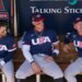 United States' Bryce Harper, left, Aaron Judge, center, and Alex Bregman sit in the team dugout prior to an exhibition baseball game against the Colorado Rockies Wednesday, March 4, 2026, in Scottsdale, Ariz.