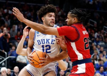 Cameron Boozer looks to make a move on Bryce Hopkins during the first half of St. John's 80-75 loss to Duke in their Sweet 16 matchup on March 27, 2026 in Washington.