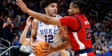 Cameron Boozer looks to make a move on Bryce Hopkins during the first half of St. John's 80-75 loss to Duke in their Sweet 16 matchup on March 27, 2026 in Washington.